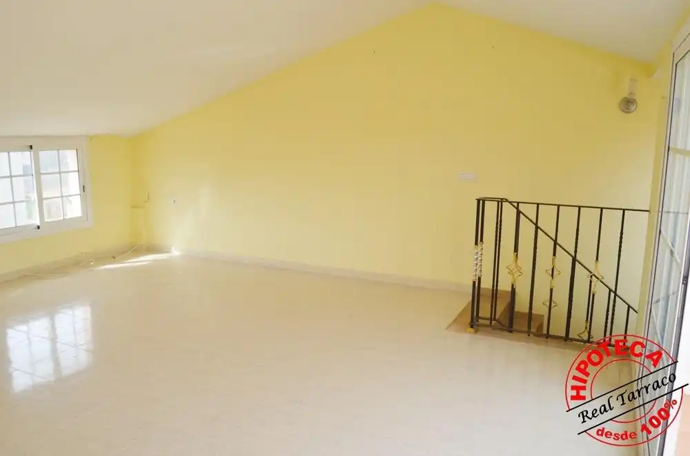 Sala de estar de Casa adosada en venta en Calafell con Piscina comunitaria