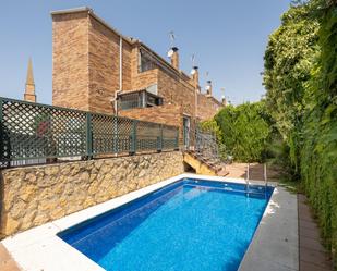 Swimming pool of Single-family semi-detached for sale in  Granada Capital  with Air Conditioner, Heating and Terrace