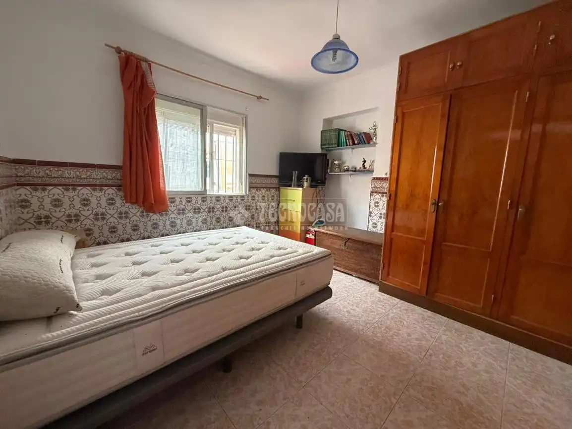 Dormitori de Casa adosada en venda en Málaga amb Jardí privat