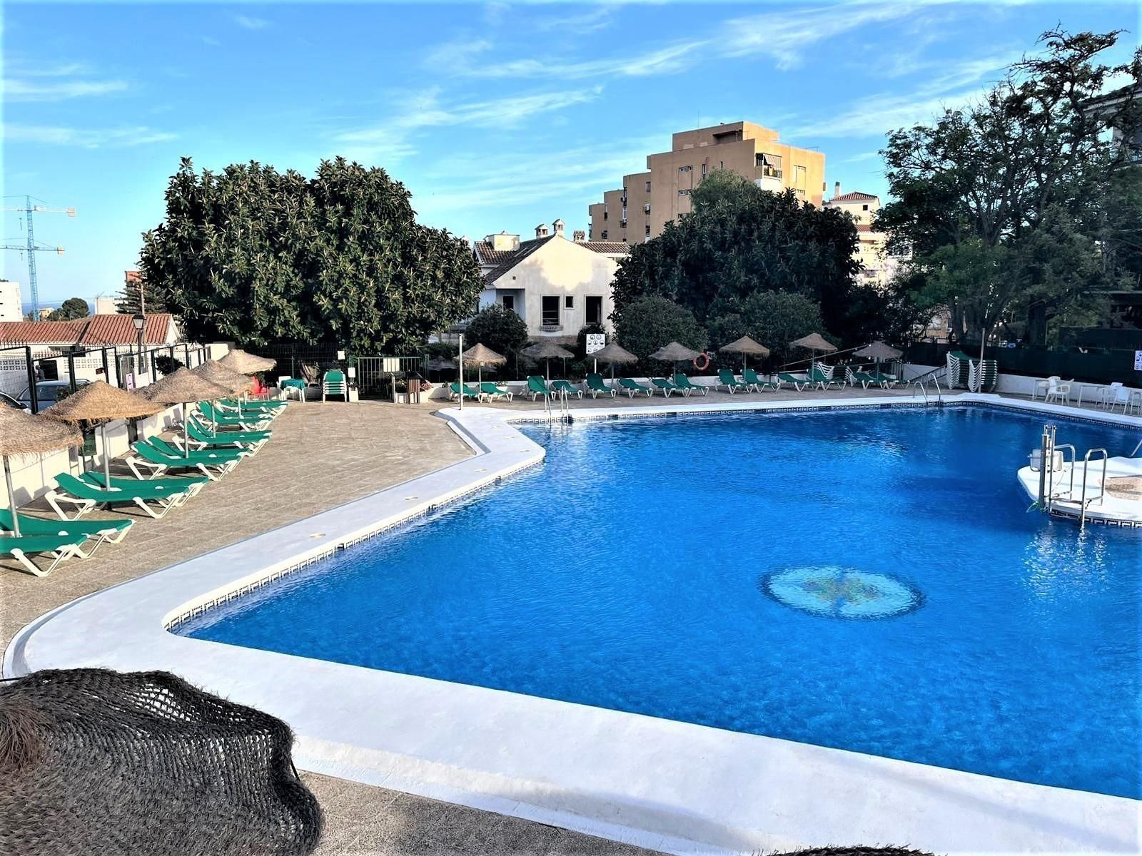 Swimming pool of Planta baja for sale in Benalmádena  with Air Conditioner and Parquet flooring