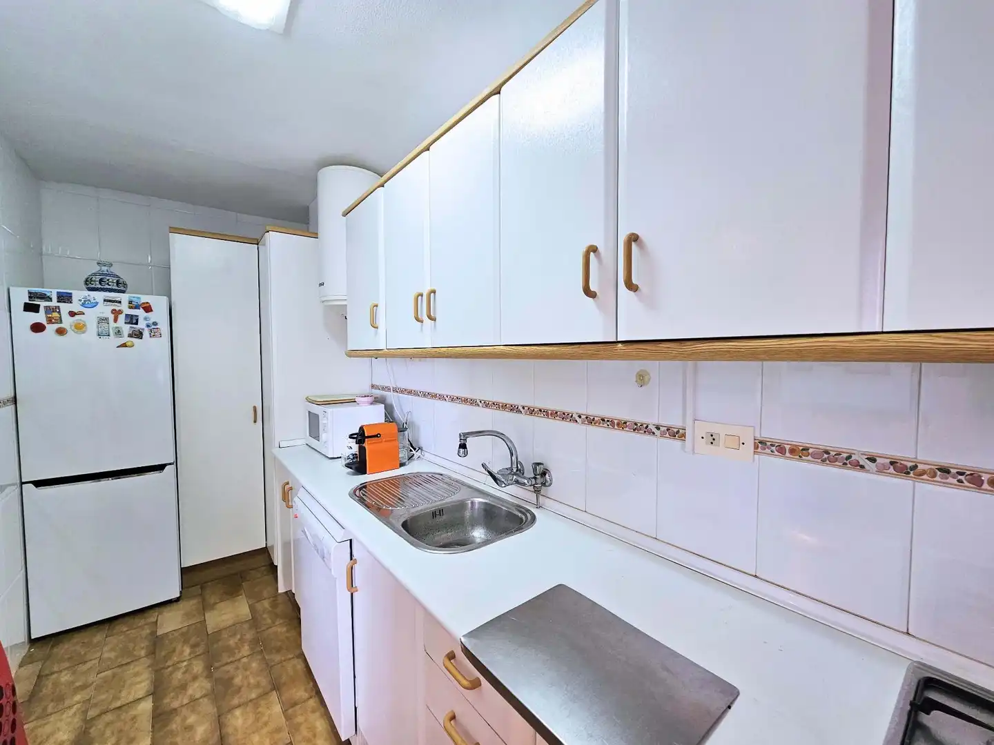 Cuina de Apartament de lloguer en La Manga del Mar Menor amb Calefacció, Terrassa i Piscina comunitària
