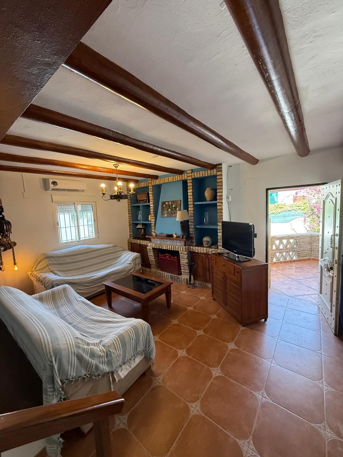 Sala d'estar de Casa o xalet de lloguer en Punta Umbría amb Aire condicionat, Jardí privat i Terrassa