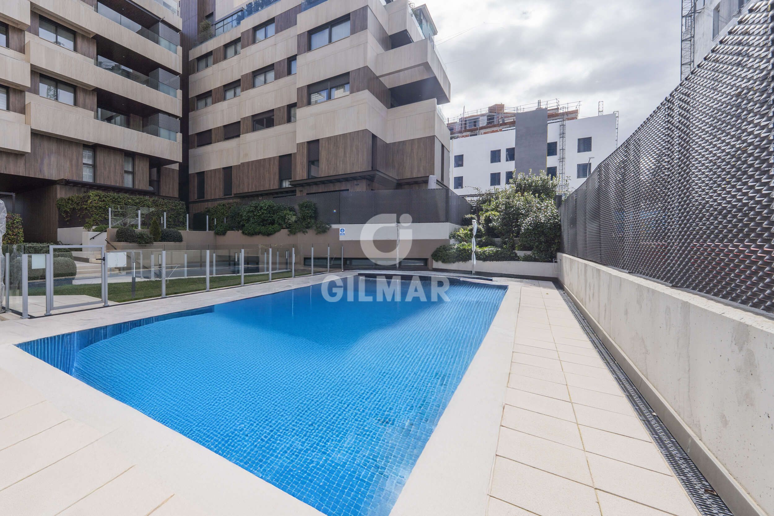 Swimming pool of Attic for sale in  Madrid Capital  with Heating, Private garden and Storage room