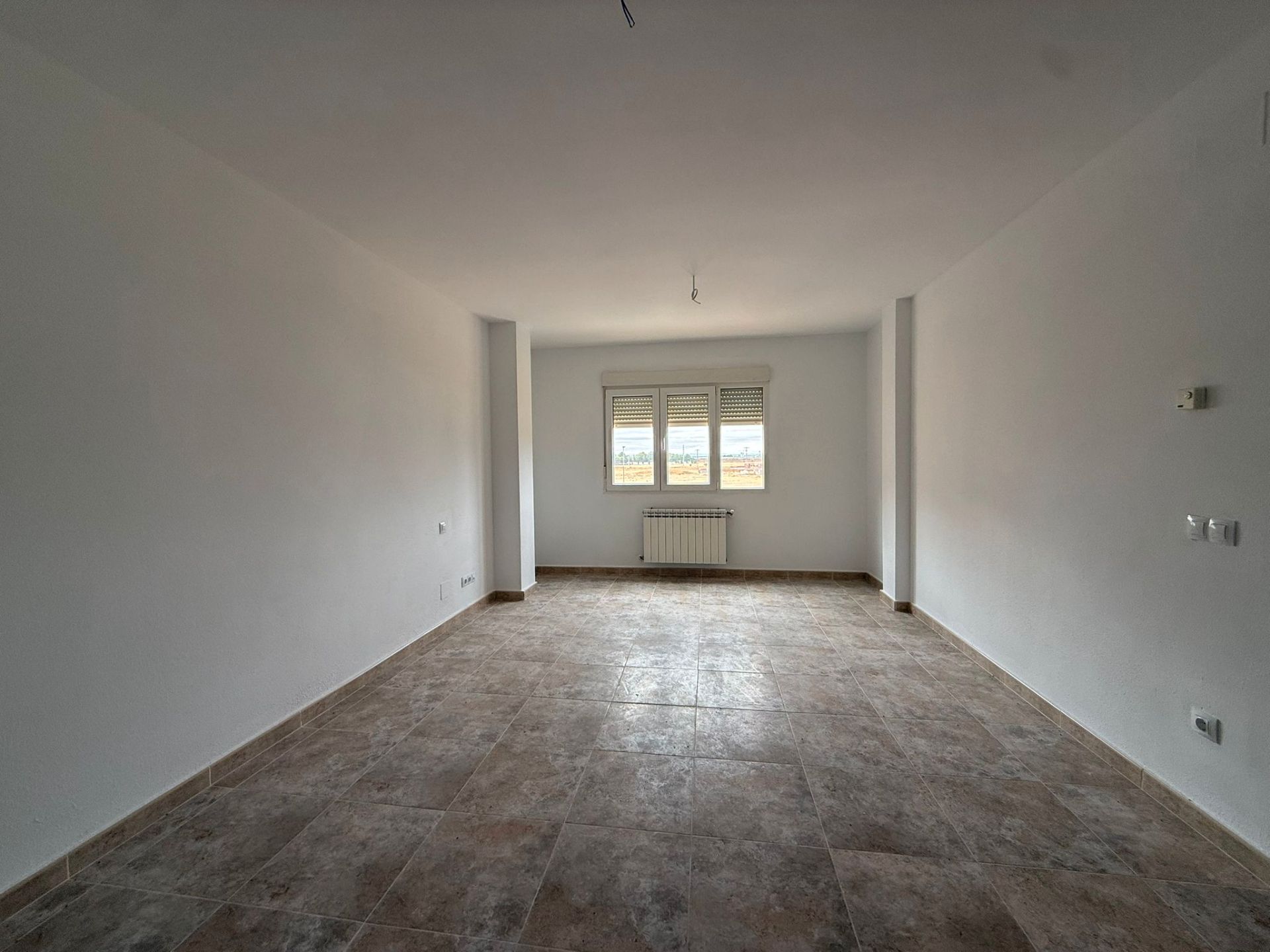 Sala d'estar de Pis en venda en Tomelloso amb Aire condicionat, Calefacció i Jardí privat