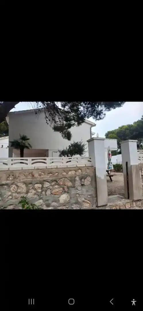 Vista exterior de Casa adosada en venda en L'Ametlla de Mar  amb Aire condicionat, Jardí privat i Parquet