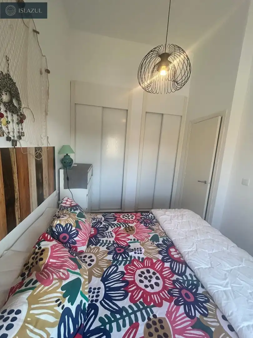 Dormitori de Apartament en venda en Isla Cristina amb Aire condicionat, Jardí privat i Terrassa