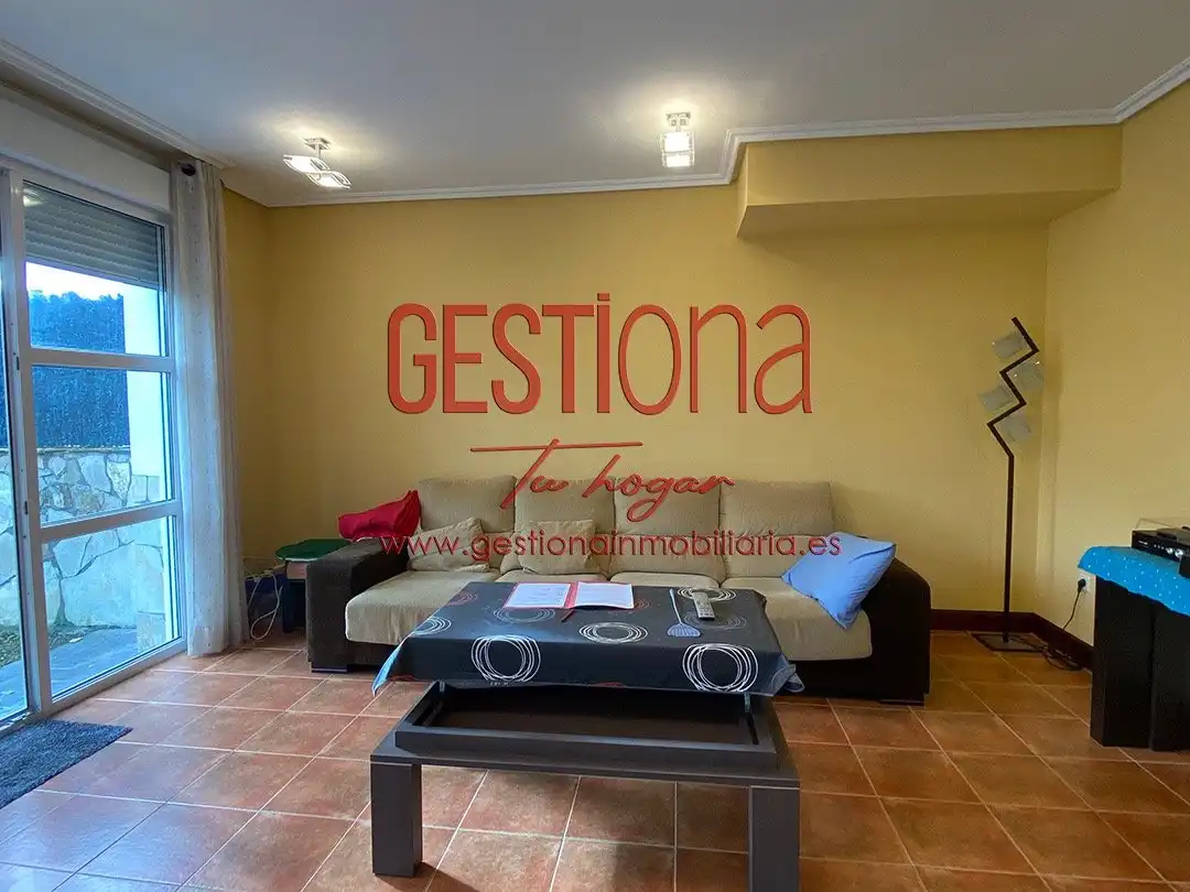 Sala de estar de Casa adosada en venta en Bareyo con Calefacción, Jardín privado y Piscina
