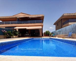 Piscina de Casa adosada en venda en L'Ampolla amb Calefacció, Jardí privat i Terrassa