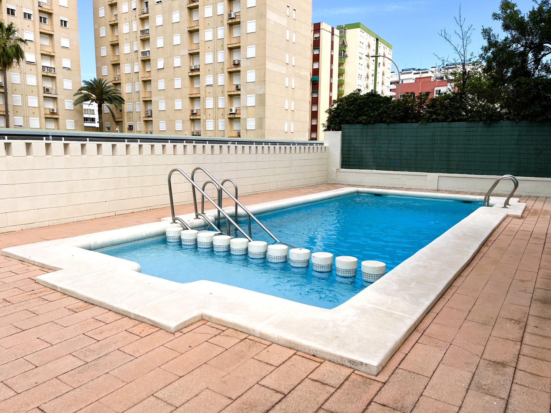 Swimming pool of Attic to rent in Gandia  with Air Conditioner, Heating and Private garden