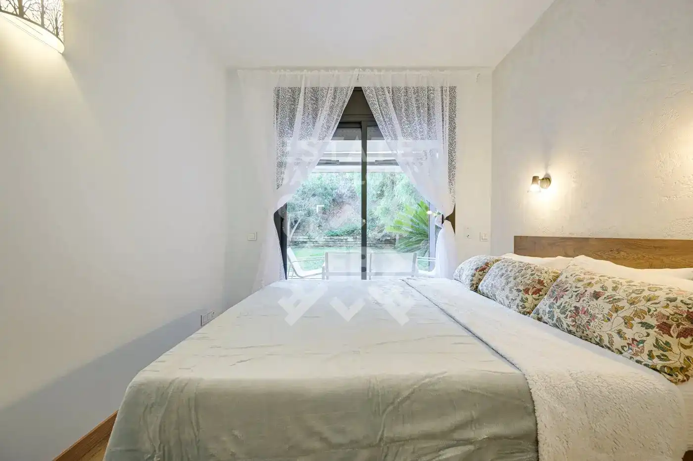 Schlafzimmer von Wohnung zum Verkauf in Lloret de Mar mit Klimaanlage, Heizung und Privatgarten