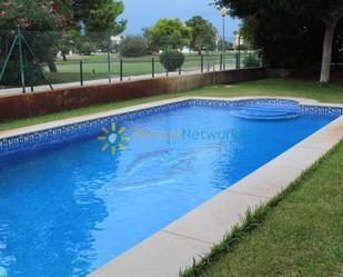 Piscina de Casa adosada de lloguer en Oliva amb Aire condicionat