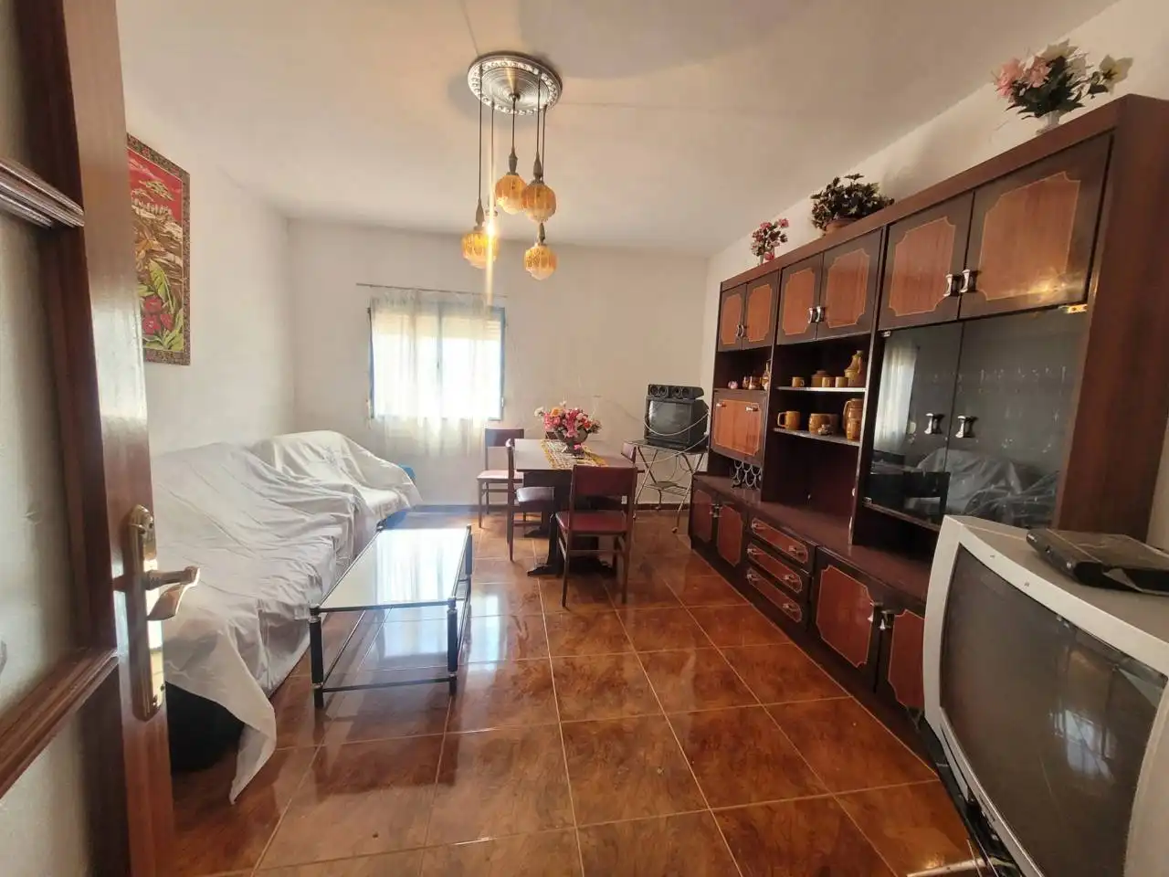 Sala d'estar de Casa o xalet en venda en Baza amb Jardí privat, Terrassa i Moblat