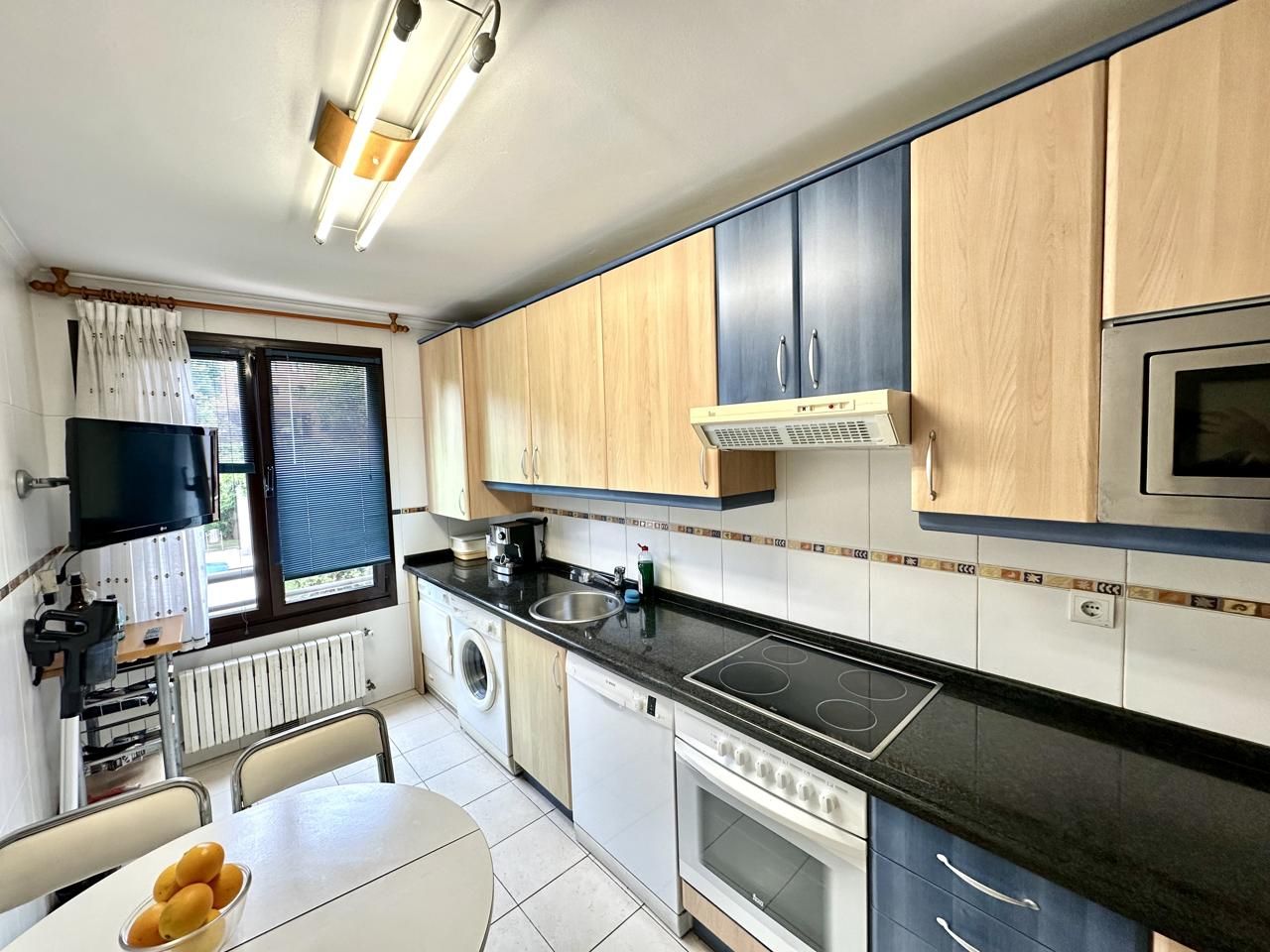 Kitchen of Flat for sale in Gijón   with Heating, Private garden and Storage room