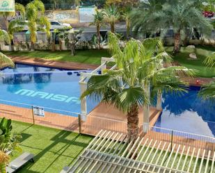 Piscina de Apartament de lloguer en El Campello amb Aire condicionat, Calefacció i Jardí privat