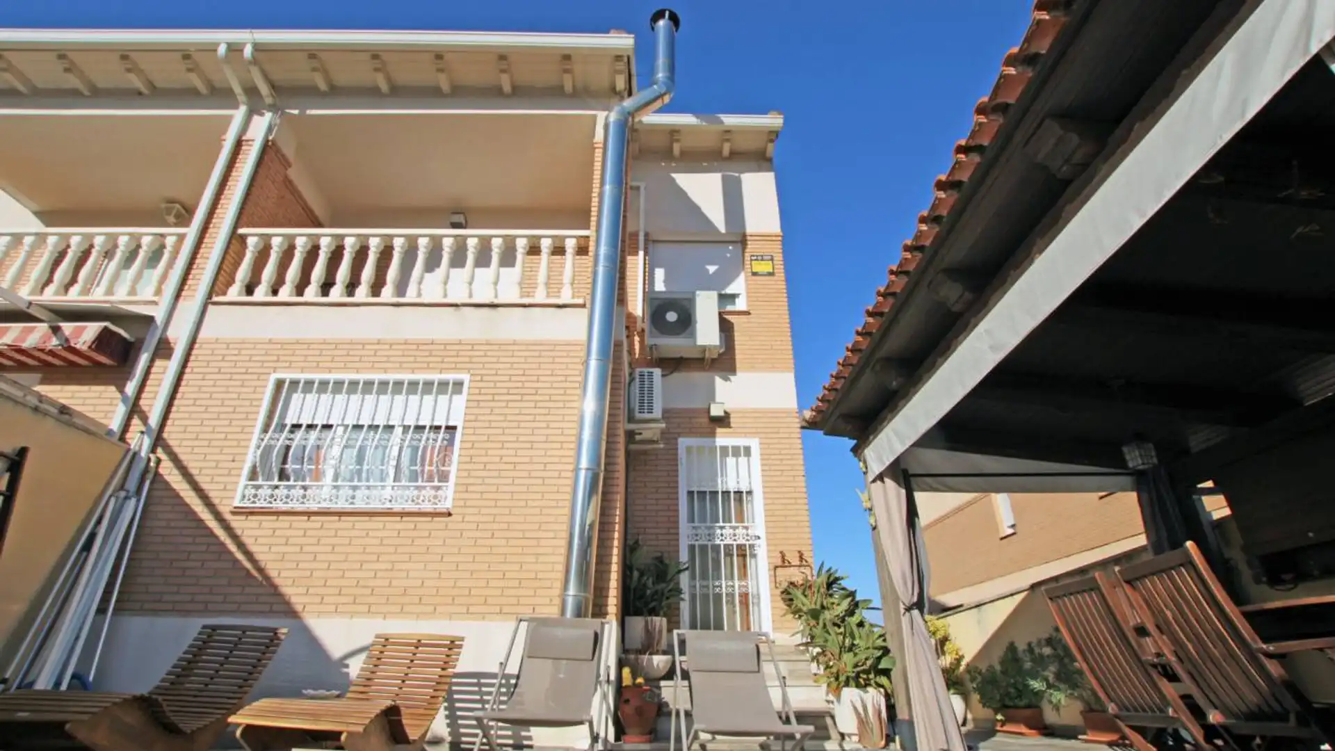 Exterior view of Single-family semi-detached for sale in Cabanillas del Campo  with Air Conditioner, Heating and Private garden