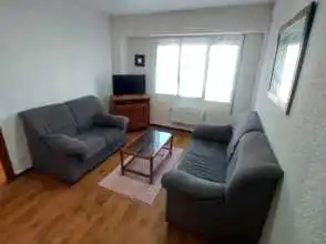 Sala d'estar de Pis de lloguer en Gijón  amb Calefacció, Parquet i Moblat