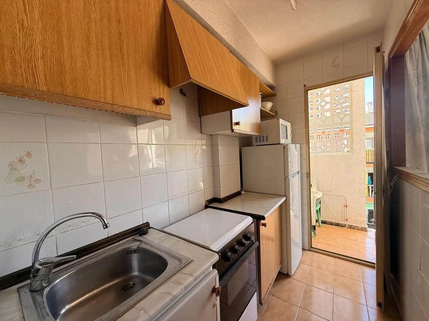 Cuina de Apartament en venda en Benidorm amb Jardí privat, Terrassa i Moblat