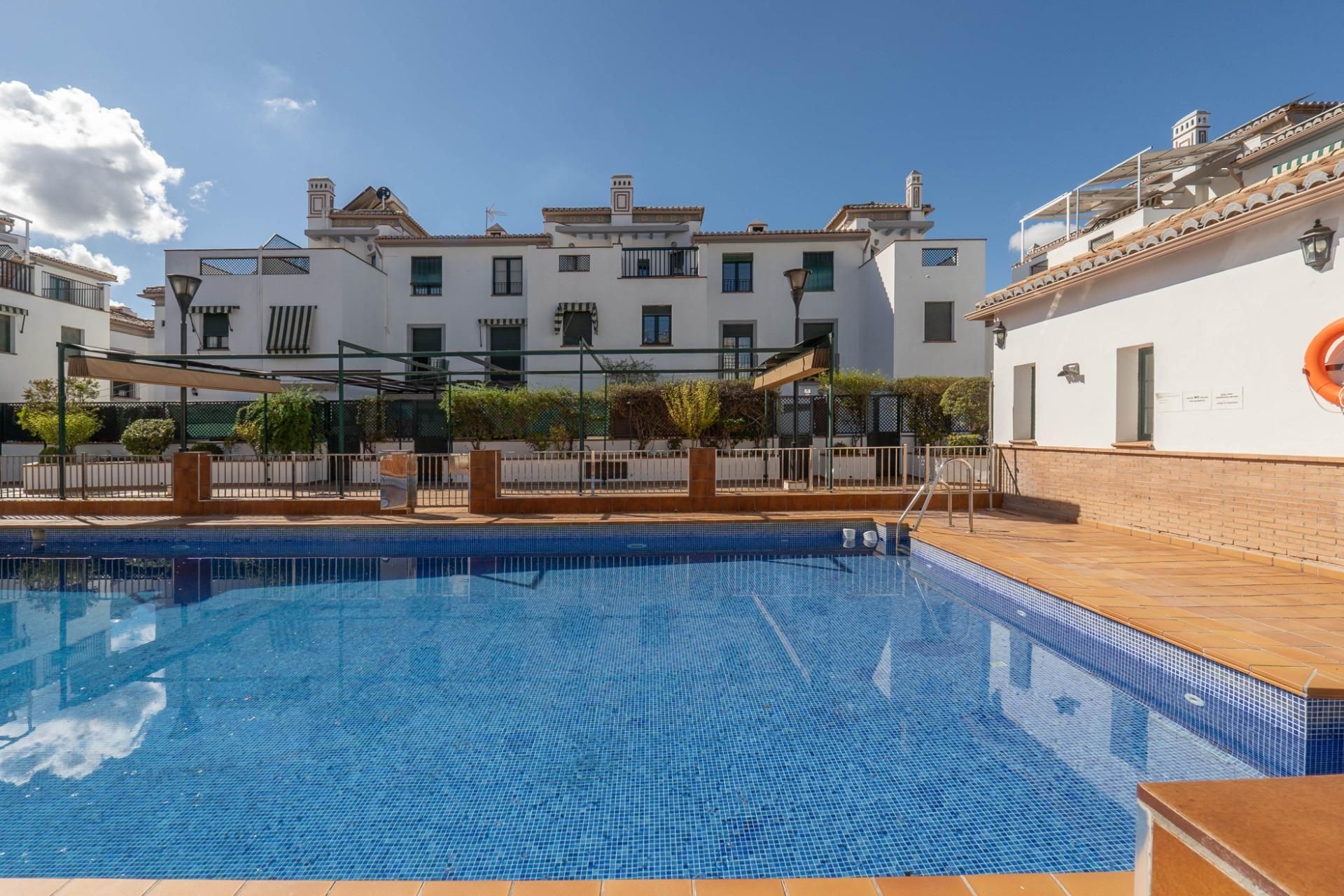Swimming pool of Single-family semi-detached for sale in Armilla  with Air Conditioner, Terrace and Community pool