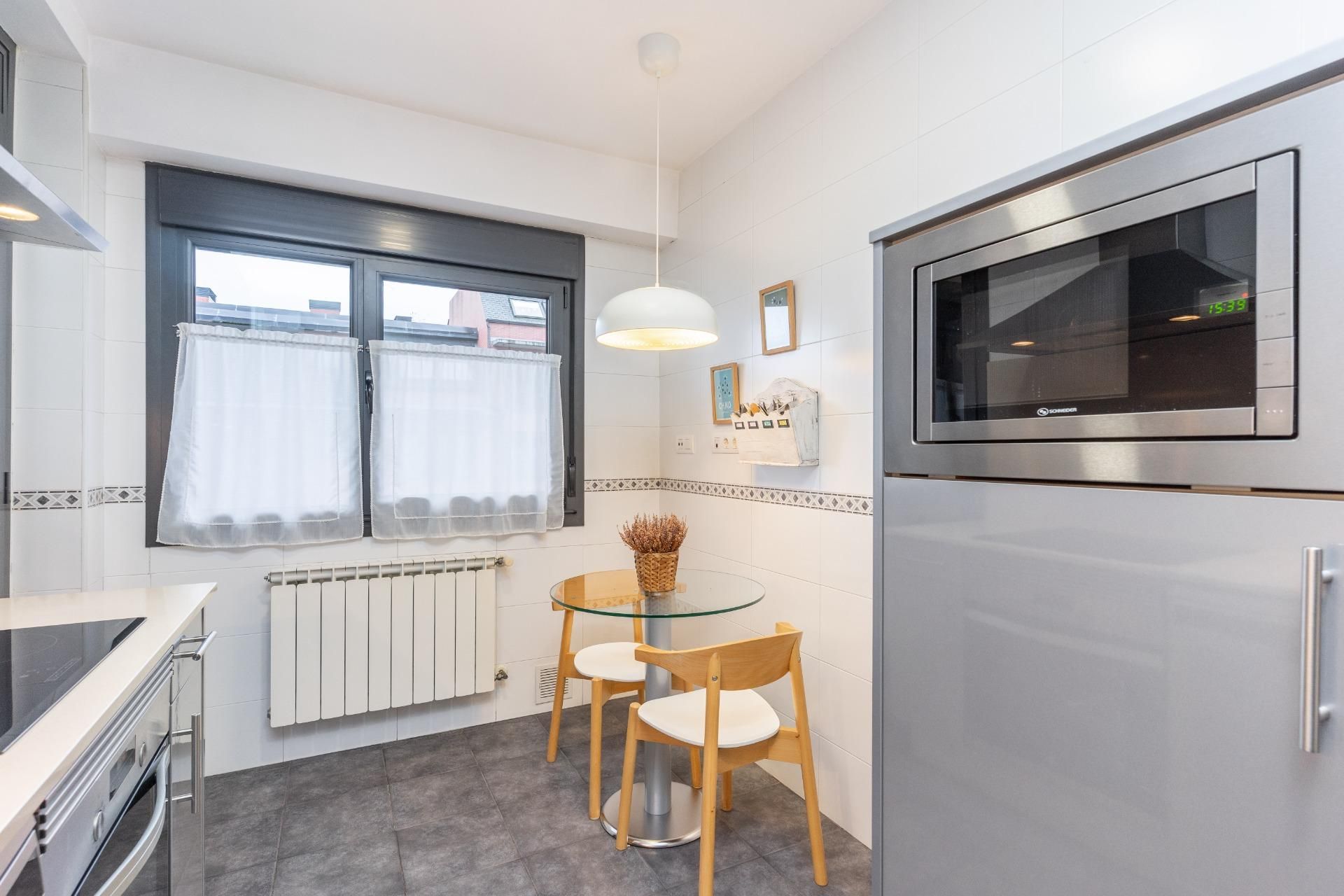 Kitchen of Flat for sale in Oviedo   with Heating, Parquet flooring and Storage room