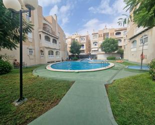 Swimming pool of Single-family semi-detached for sale in Torrevieja  with Air Conditioner, Terrace and Balcony