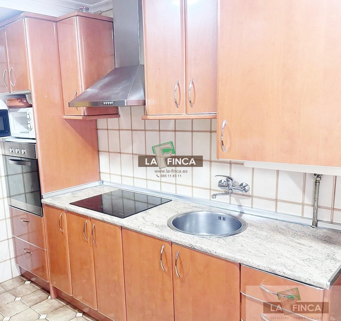 Kitchen of Flat for sale in Oviedo   with Heating, Parquet flooring and Storage room