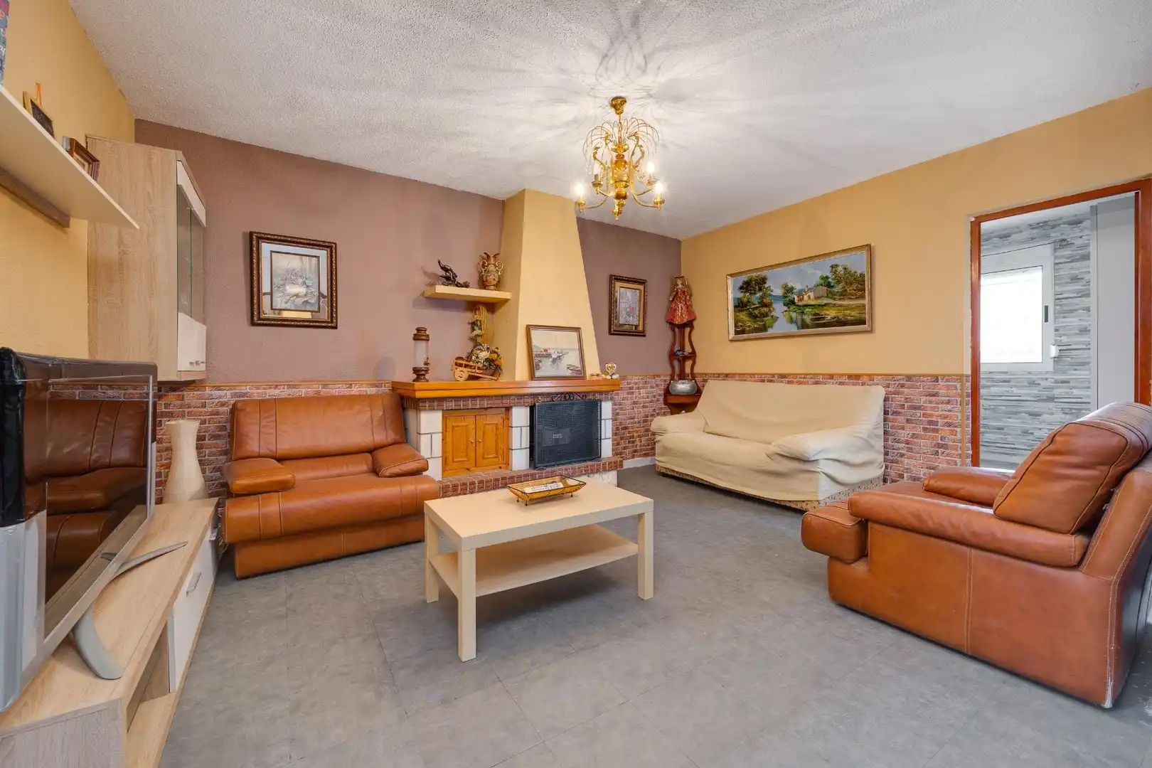 Sala d'estar de Casa adosada en venda en Orihuela amb Aire condicionat, Jardí privat i Terrassa