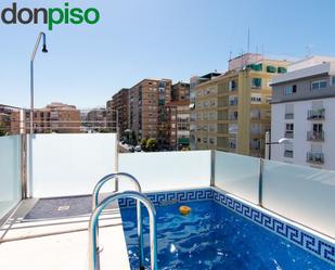 Swimming pool of Single-family semi-detached for sale in  Granada Capital  with Air Conditioner, Terrace and Swimming Pool