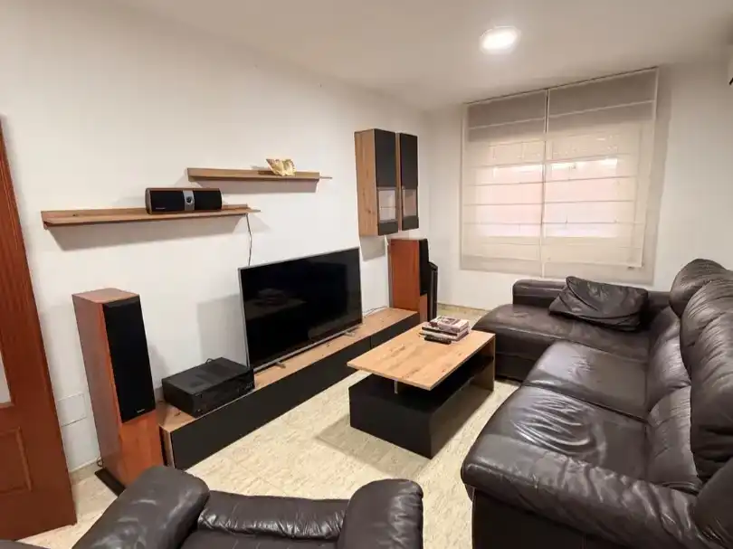 Sala d'estar de Dúplex per a compartir en Almería amb Aire condicionat, Moblat i Balcó