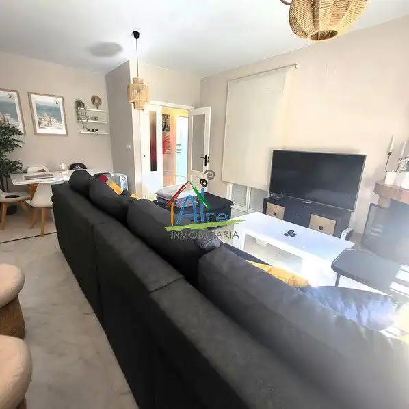 Sala de estar de Casa adosada en venta en Almonte con Aire acondicionado, Calefacción y Jardín privado