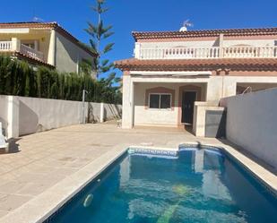 Piscina de Casa adosada de lloguer en Mont-roig del Camp amb Aire condicionat, Terrassa i Piscina