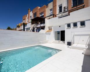 Swimming pool of Single-family semi-detached for sale in  Granada Capital  with Air Conditioner, Heating and Private garden