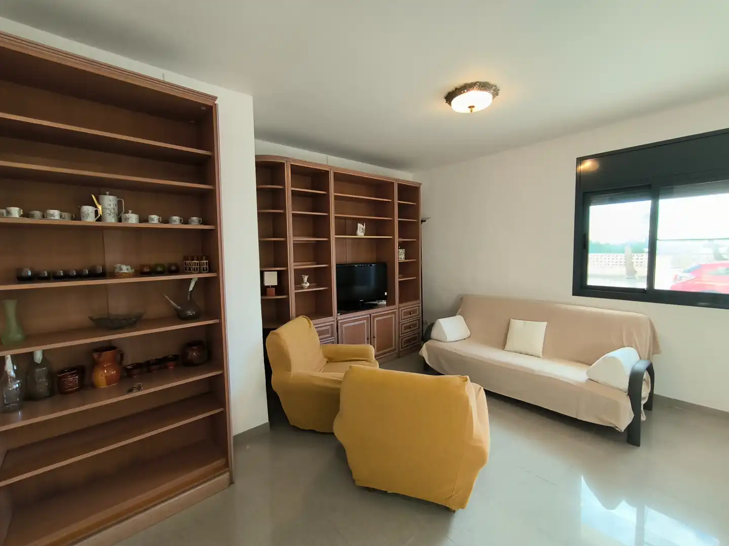 Sala d'estar de Apartament en venda en Alcanar amb Aire condicionat, Jardí privat i Terrassa