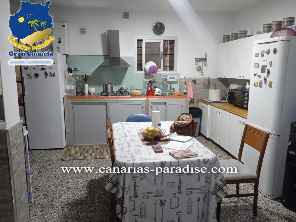Cuina de Casa adosada en venda en Mogán amb Aire condicionat, Jardí privat i Moblat