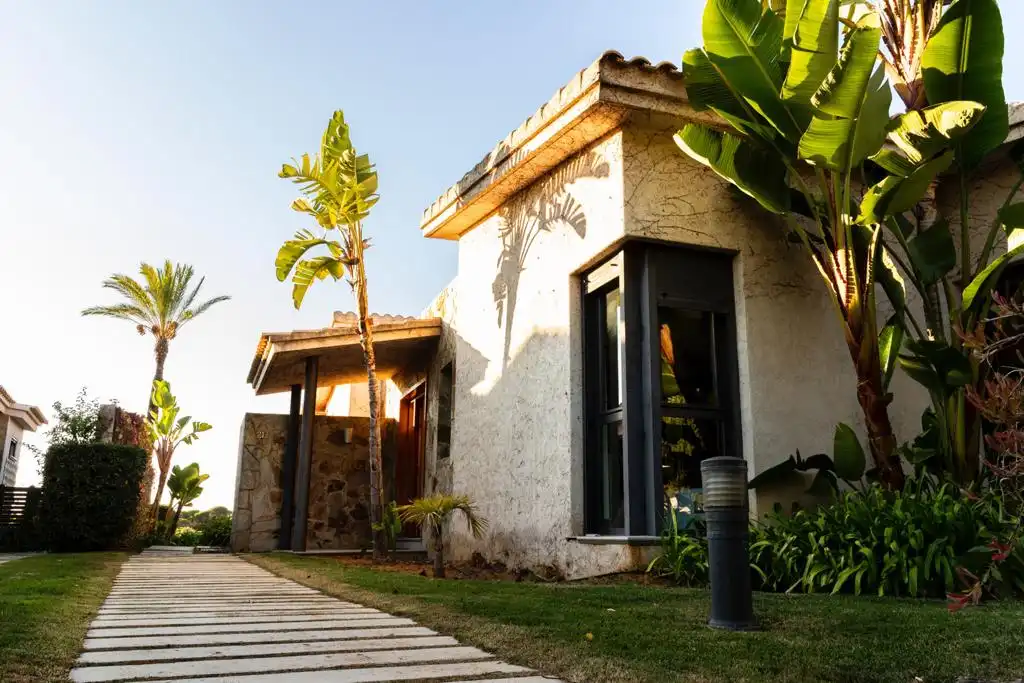 Vista exterior de Casa o xalet de lloguer en El Rompido amb Aire condicionat, Calefacció i Jardí privat