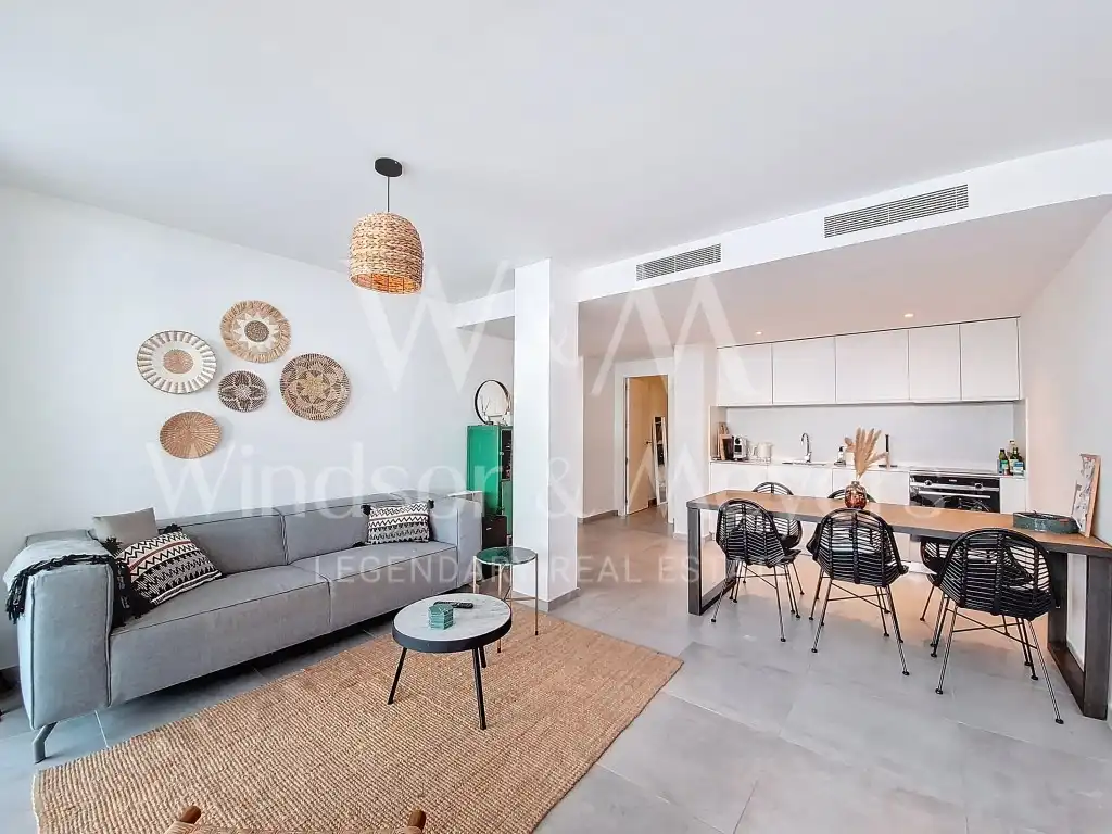 Sala d'estar de Apartament en venda en Sant Josep de sa Talaia amb Aire condicionat, Piscina i Moblat