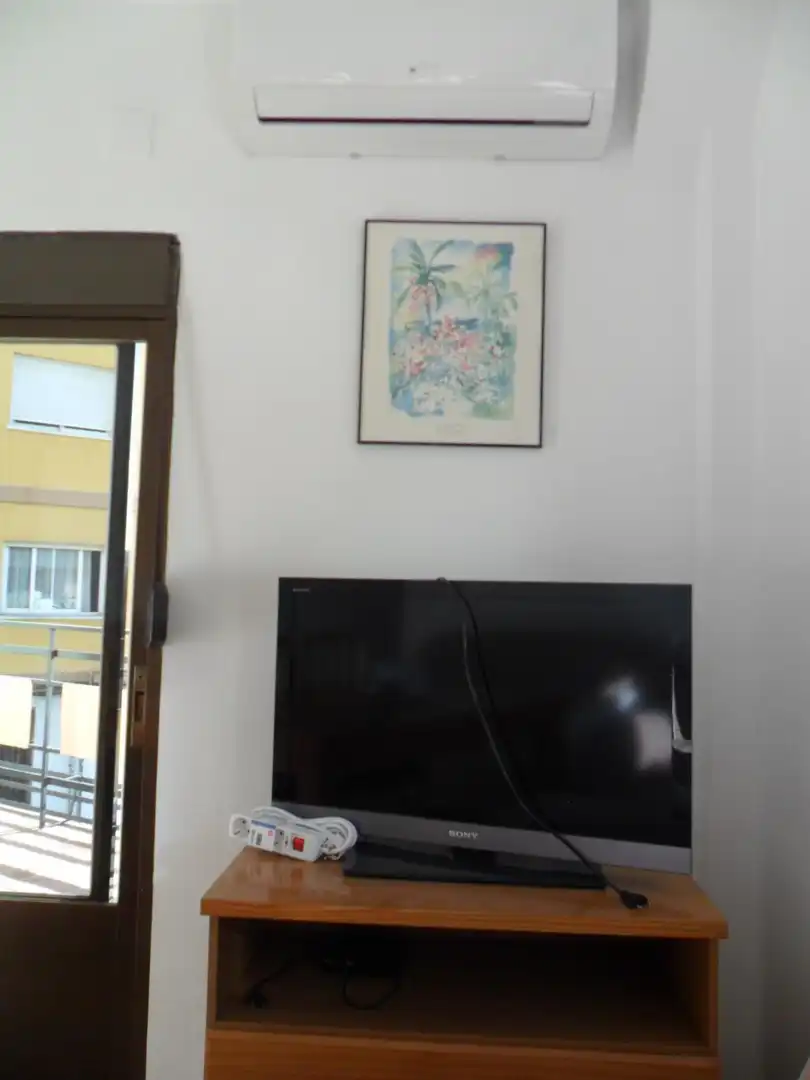 Sala d'estar de Pis de lloguer en Granada amb Aire condicionat, Terrassa i Moblat