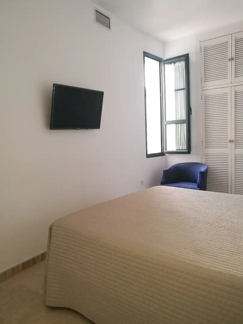 Dormitori de Apartament de lloguer en Sevilla amb Aire condicionat, Moblat i Rentadora
