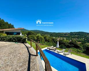 Vista exterior de Casa o xalet en venda en Vilaboa amb Aire condicionat, Terrassa i Piscina