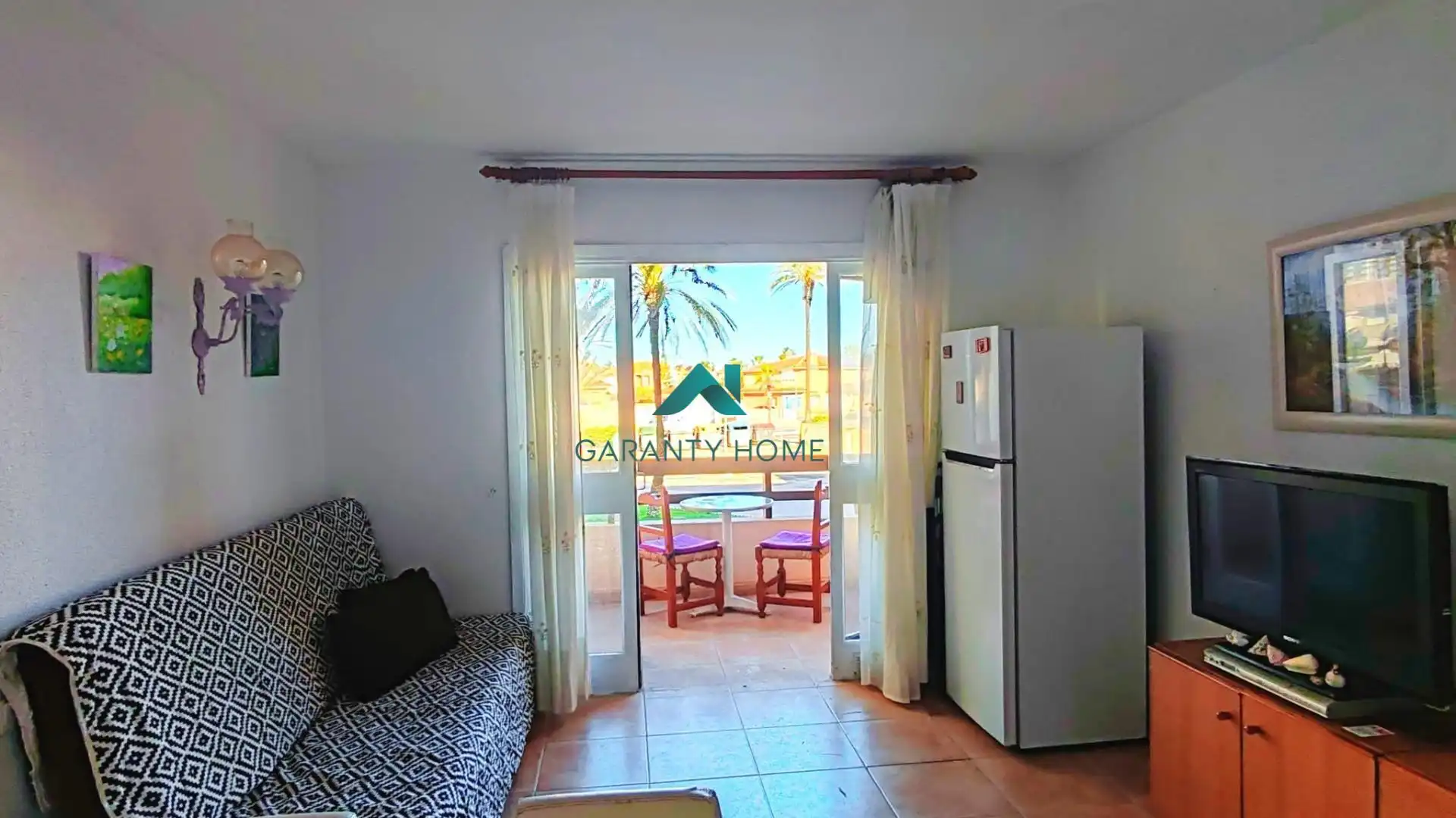 Sala de estar de Apartamento en venta en La Manga del Mar Menor con Amueblado, Balcón y Piscina comunitaria