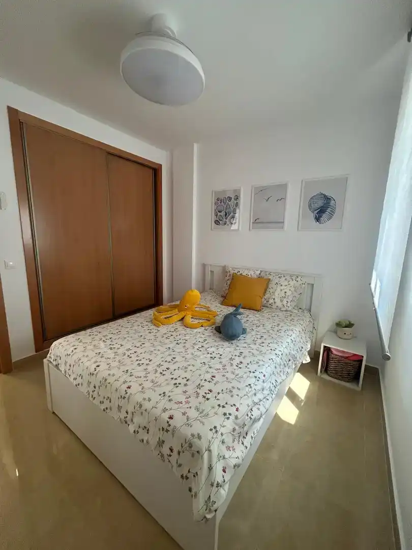 Dormitori de Pis de lloguer en Pulpí amb Aire condicionat, Piscina i Moblat