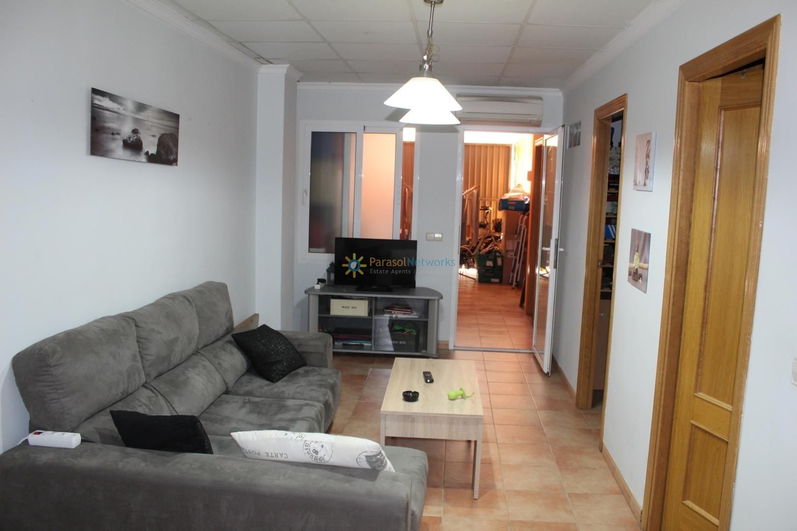 Sala d'estar de Casa adosada en venda en Piles amb Aire condicionat, Terrassa i Traster