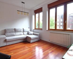 Living room of Flat for sale in Gijón   with Heating, Parquet flooring and Furnished
