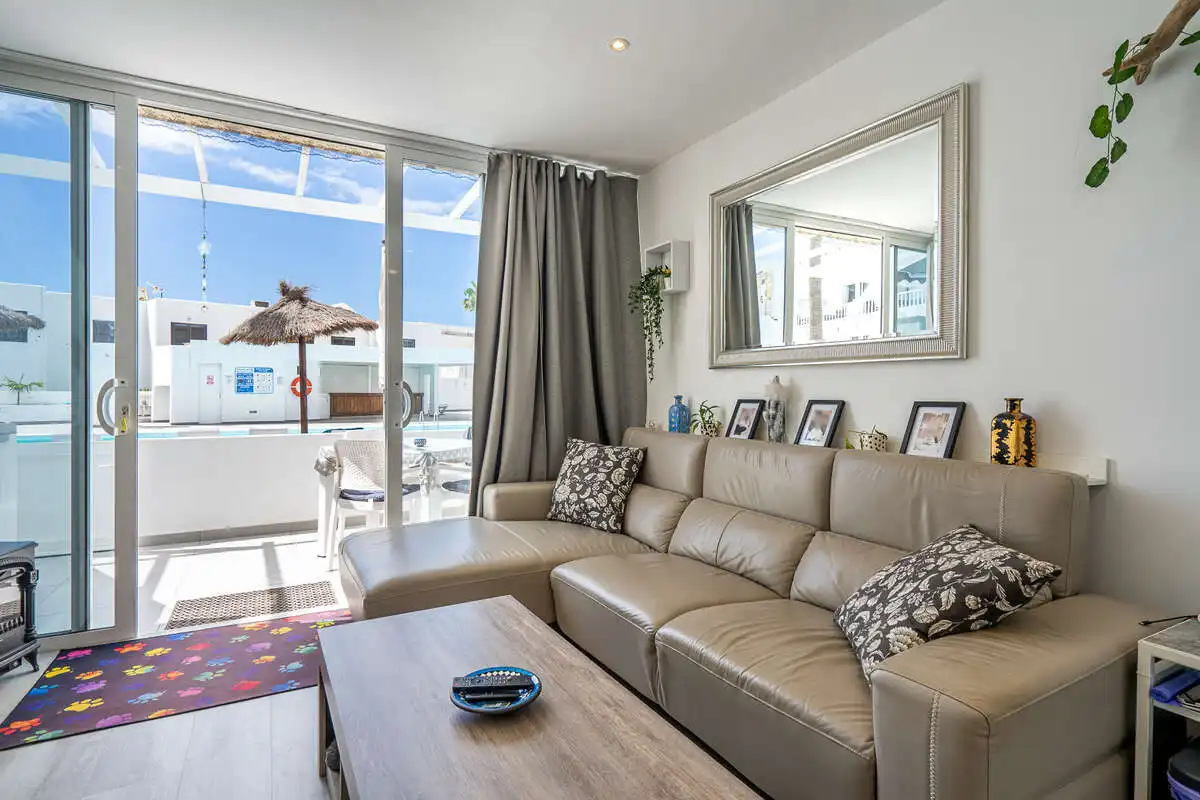 Sala de estar de Piso en venta en Tías con Balcón y Piscina comunitaria