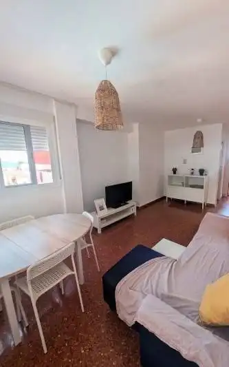 Sala d'estar de Apartament de lloguer en La Pobla de Farnals amb Aire condicionat, Moblat i Balcó