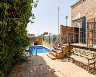 Exterior view of Single-family semi-detached for sale in  Granada Capital  with Air Conditioner, Terrace and Swimming Pool