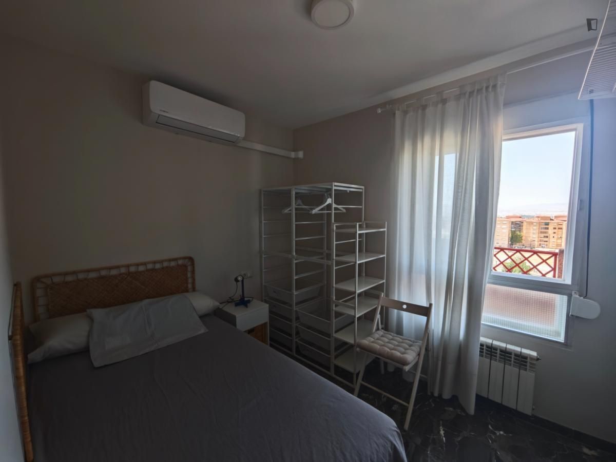 Bedroom of Apartment to share in  Granada Capital  with Air Conditioner, Heating and Furnished