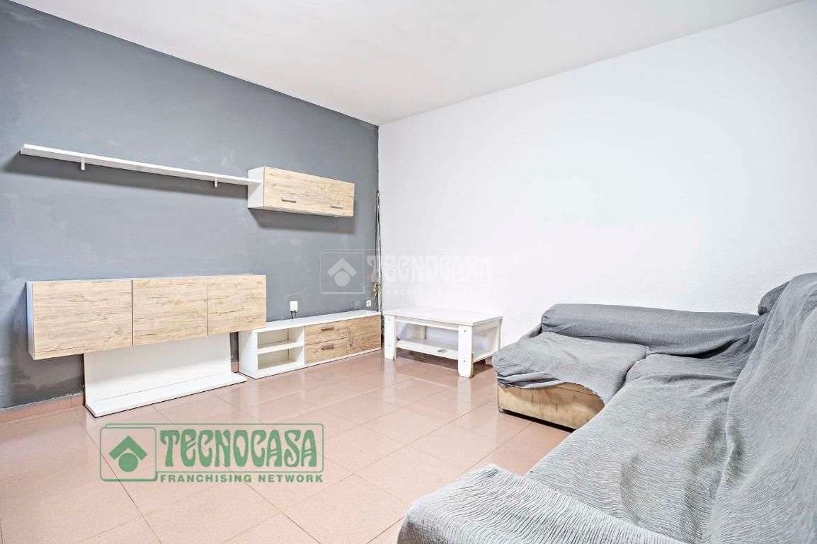 Sala d'estar de Casa adosada en venda en Roquetas de Mar