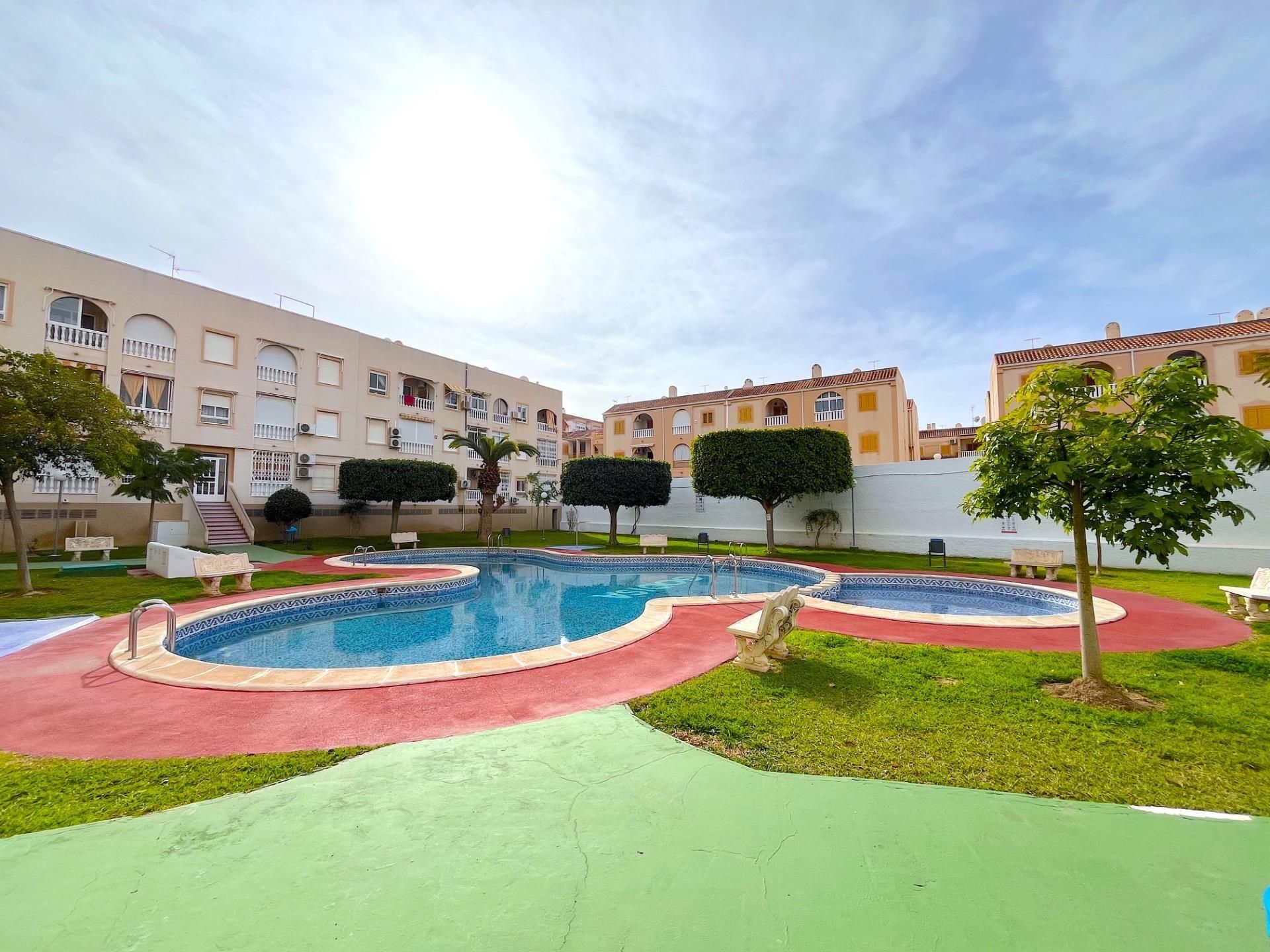 Swimming pool of Apartment for sale in Torrevieja  with Air Conditioner, Heating and Private garden