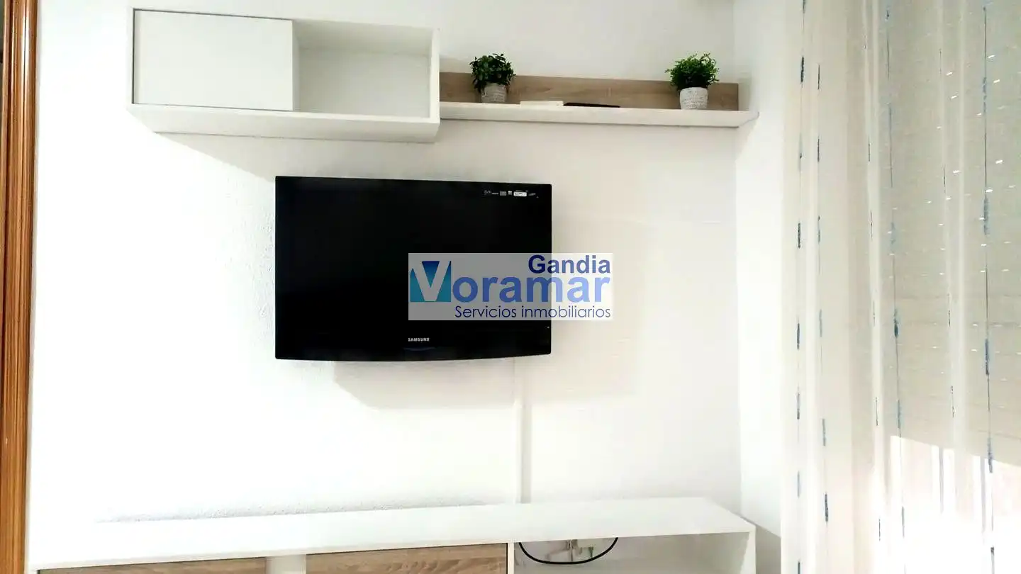 Sala d'estar de Apartament en venda en Gandia amb Aire condicionat, Jardí privat i Terrassa