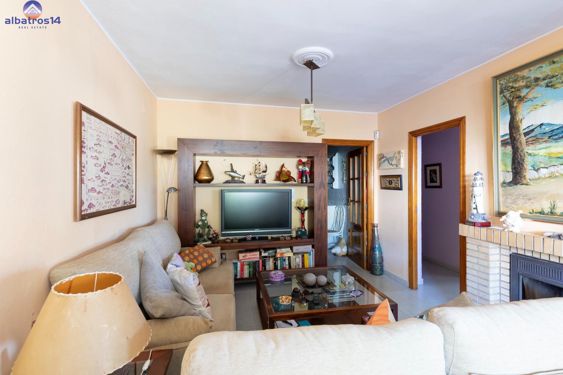 Sala de estar de Casa adosada en venta en El Rompido con Jardín privado, Terraza y Trastero